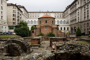 he Church of St George (??????? ????? ?????? or Rotonda "Sveti Georgi") is an Early Christian red brick rotunda that is considered the oldest building in Sofia, the capital of Bulgaria. The rotunda has a diameter of 9.5m and is about 14m high. It's brick walls are an impressive 1.40m thick. The building is situated amid remains of the ancient town of Serdica. Built by the Romans in the 4th century CE, it is mainly famous for the 12th-14th century frescoes inside the central dome. Three layers of frescoes have been discovered, the earliest dating back to the 10th century. Magnificent frescoes of 22 prophets over 2 metres tall crown the dome. The original function of the rotunda is still debated. Some say it was built as a bath (or kaldarium), others argue that since it was located in the centre of 2nd century AD Roman public buildings, it likely had a religious and ceremonial function. Emperor Constantine the Great turned the Rotunda into a Christian temple, which surived until the invasion of Attila's Huns, when it was almost completely destroyed. It was reconstructed during the reign of Emperor Justinian. During the reign of sultan Selim I (16th century), the church was turned into a mosque, the 'Gyul Mosque'. A minaret was constructed, and the Early Christian art was painted over with Islamic decorative elements. The original frescoes (3 layers) were only uncovered during restoration works in the 20th century.